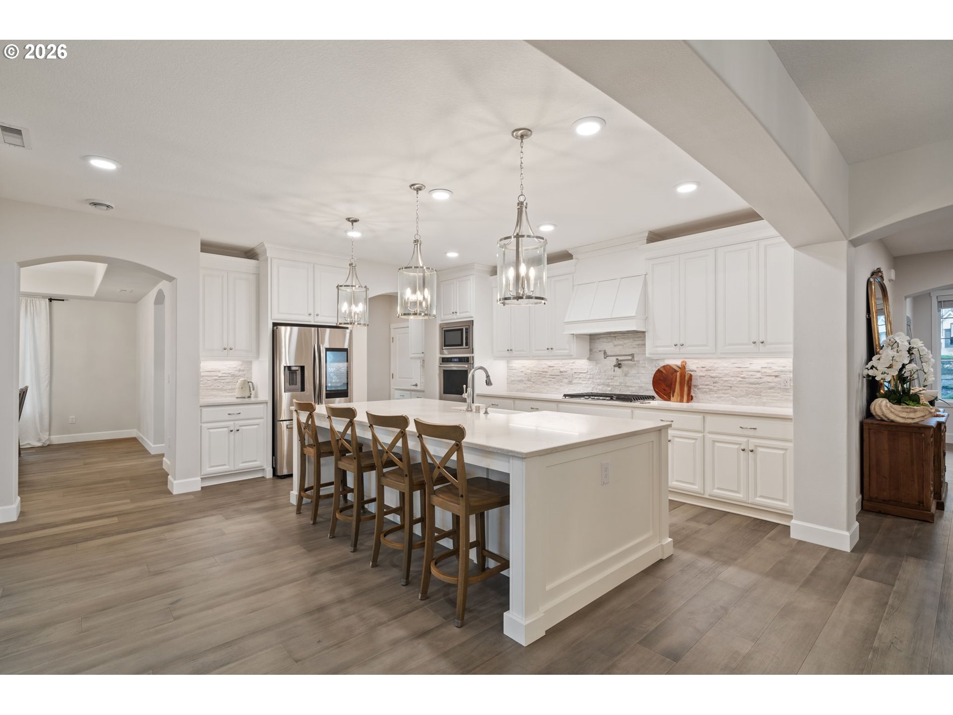 4024 South Winery Way Ridgefield, WA 98642 - Photo 14 of 48 a kitchen with a table and chairs in it