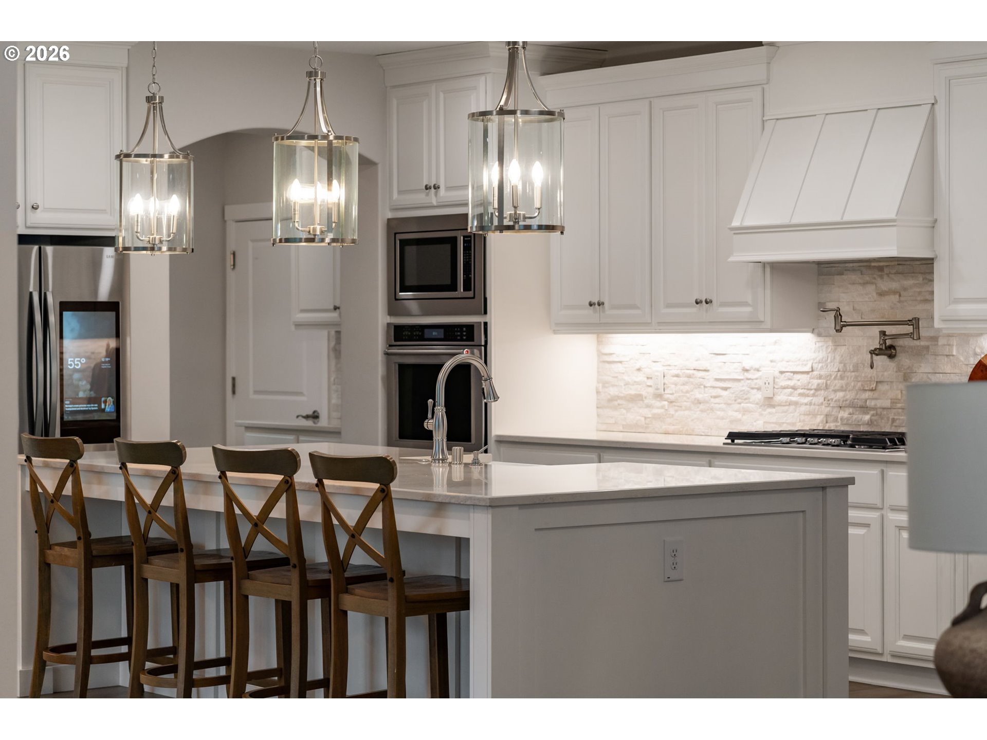 4024 South Winery Way Ridgefield, WA 98642 - Photo 15 of 48 a kitchen with granite countertop a sink stainless steel appliances and cabinets