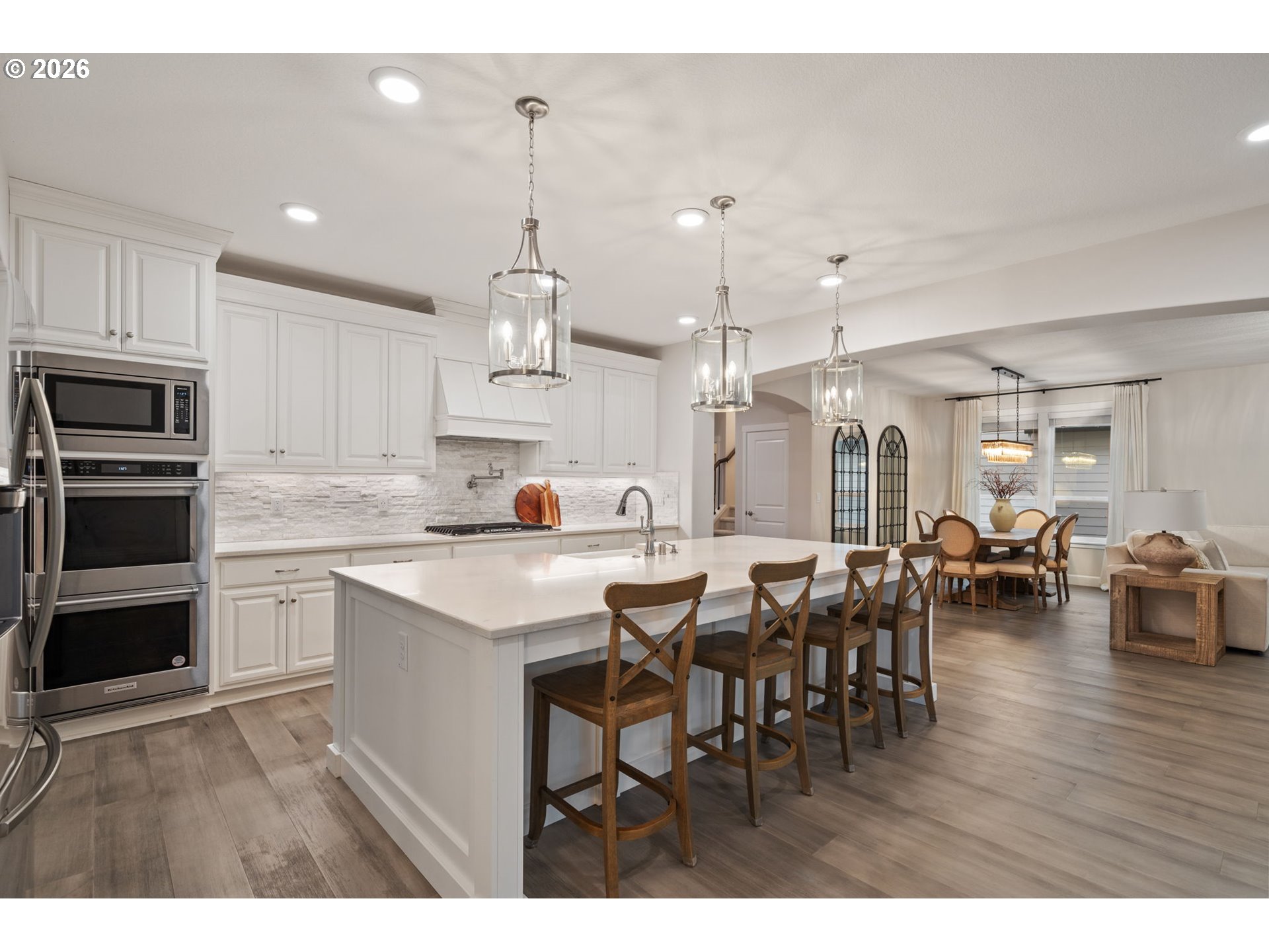 4024 South Winery Way Ridgefield, WA 98642 - Photo 16 of 48 a open kitchen with kitchen island a sink table and chairs