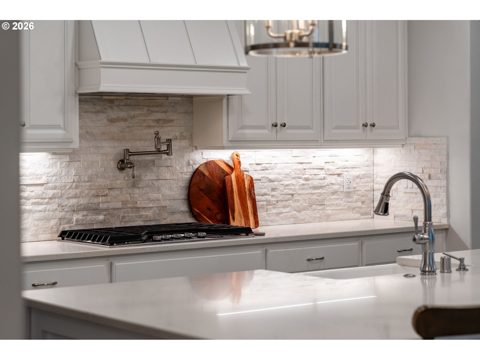 4024 South Winery Way Ridgefield, WA 98642 - Photo 17 of 48 a kitchen with a sink and cabinets