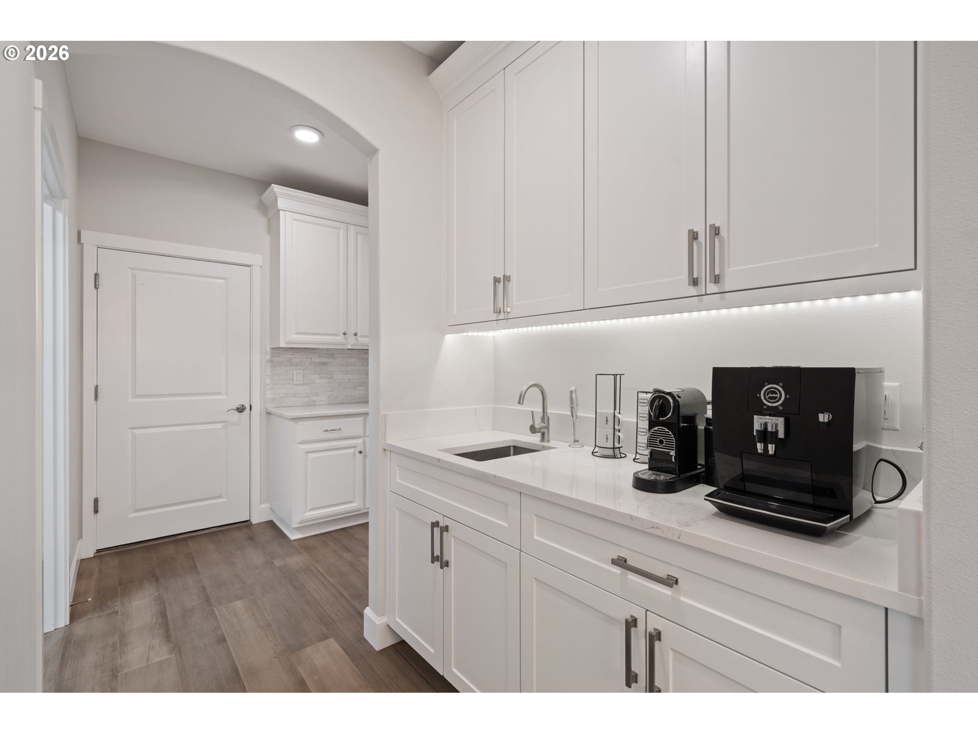 4024 South Winery Way Ridgefield, WA 98642 - Photo 22 of 48 a kitchen with white cabinets and sink