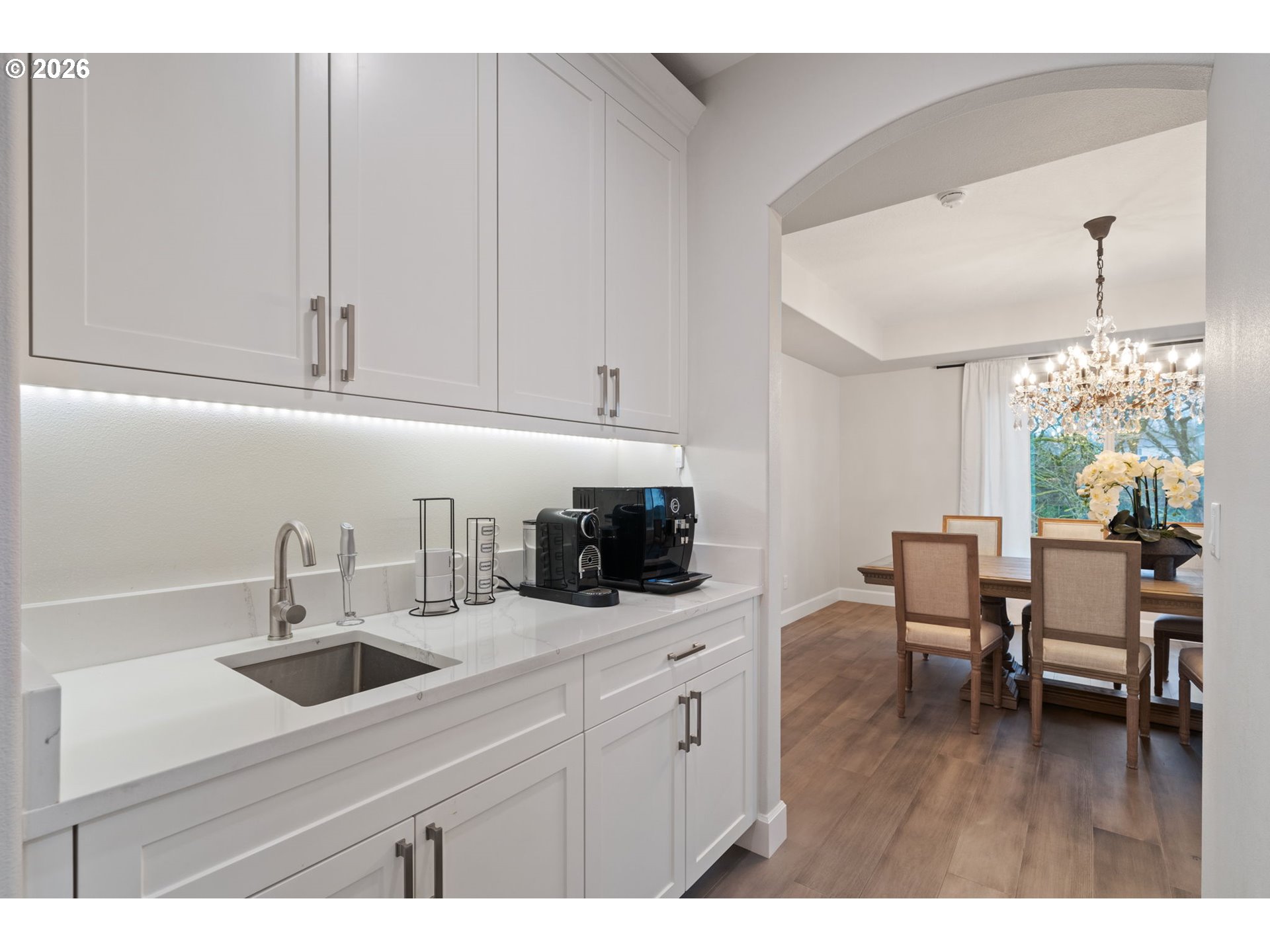 4024 South Winery Way Ridgefield, WA 98642 - Photo 24 of 48 a kitchen with sink cabinets and wooden floor