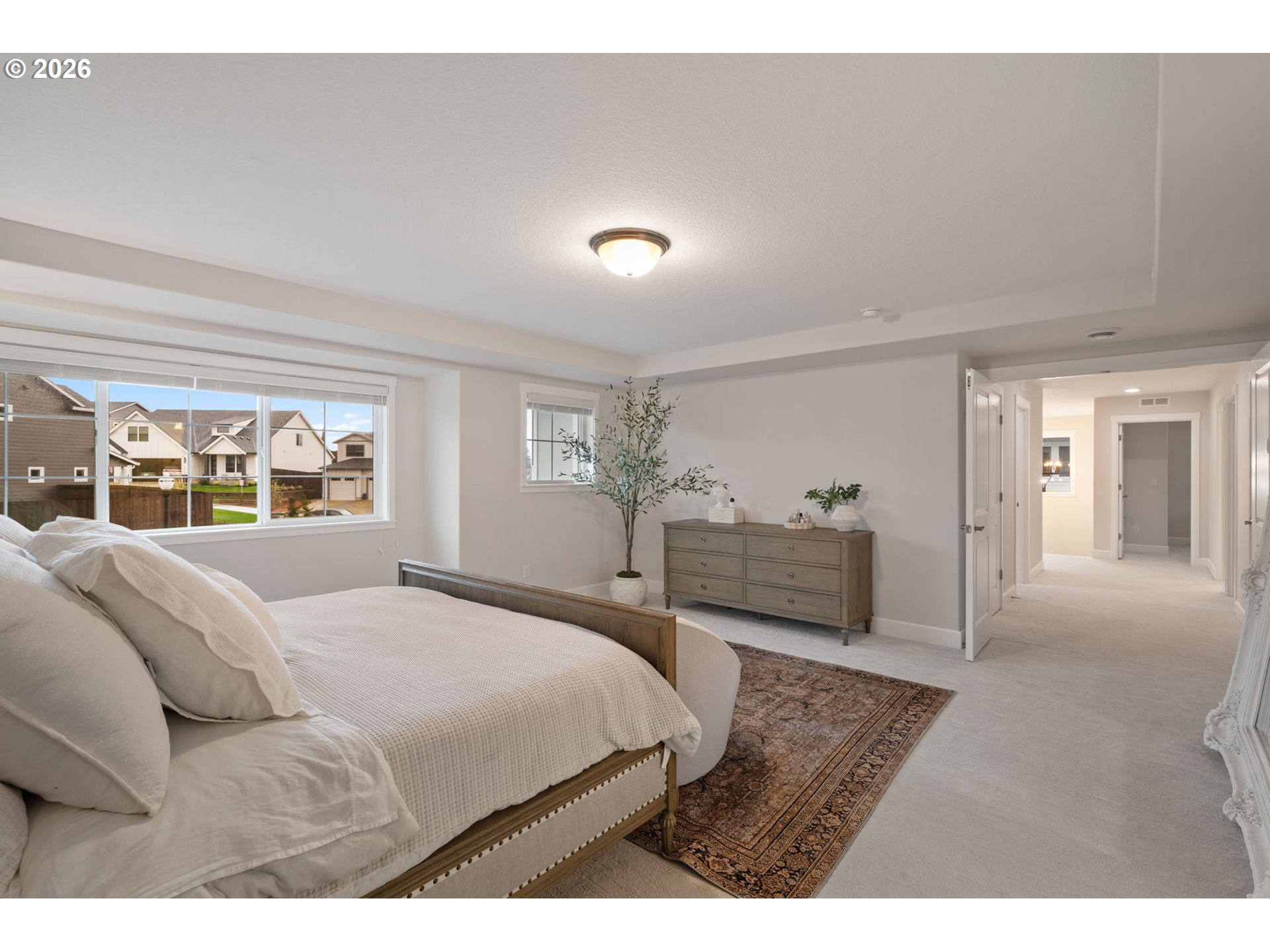 4024 South Winery Way Ridgefield, WA 98642 - Photo 27 of 48 a bedroom with a bed and a large window
