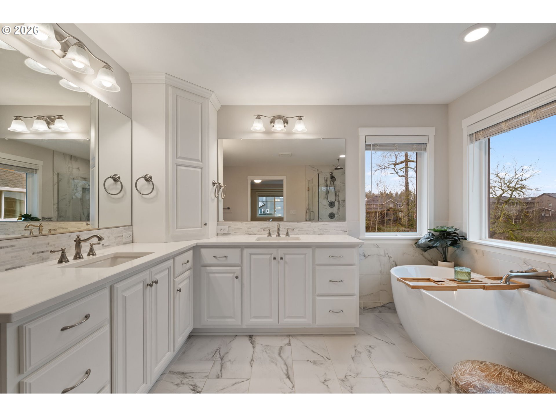 4024 South Winery Way Ridgefield, WA 98642 - Photo 31 of 48 a bathroom with a granite countertop double vanity sink a mirror and a bathtub