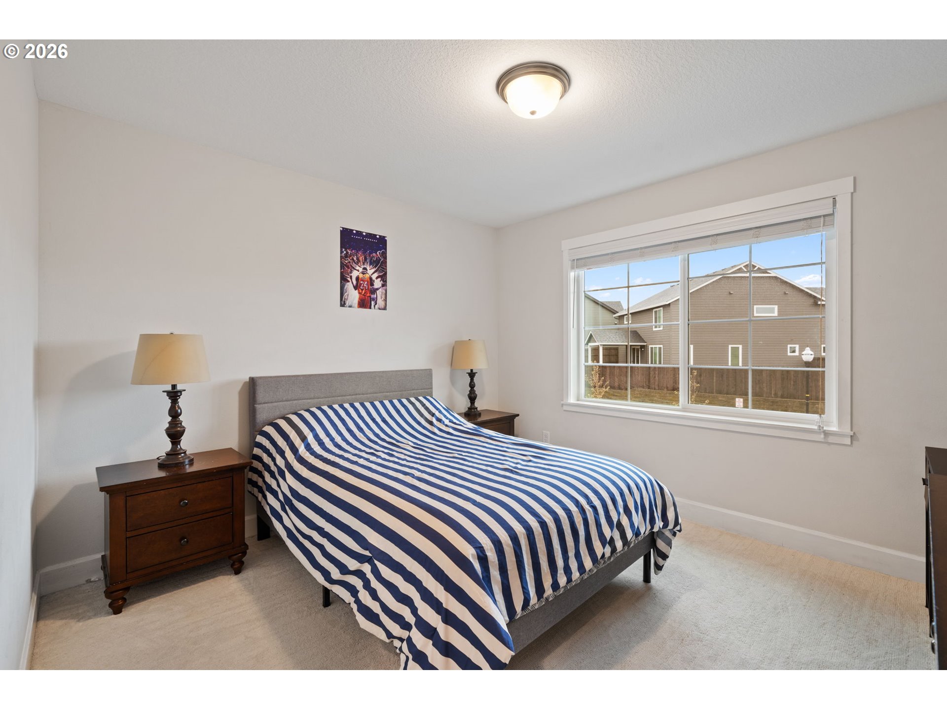 4024 South Winery Way Ridgefield, WA 98642 - Photo 36 of 48 a bedroom with a bed and a night stand