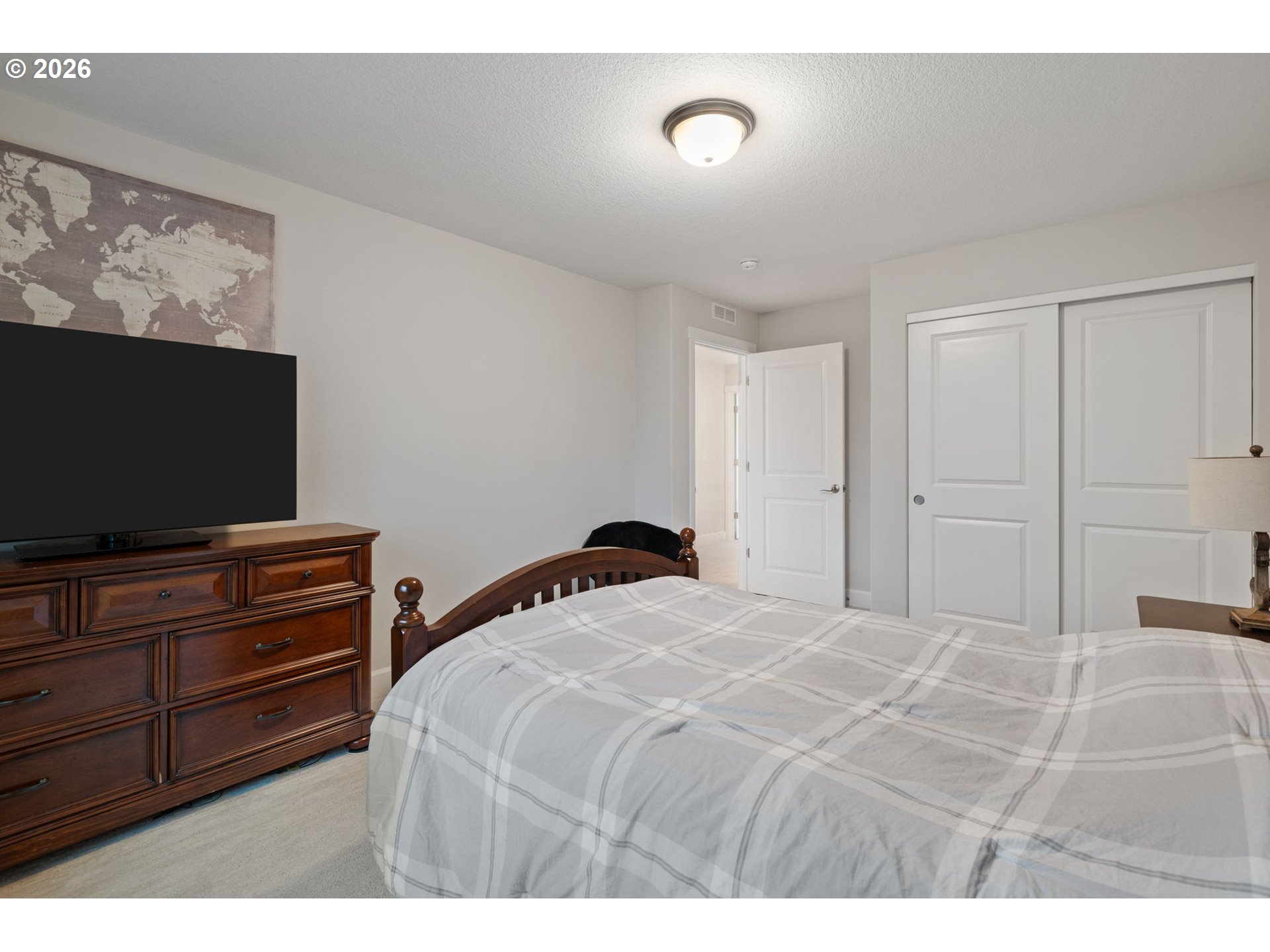 4024 South Winery Way Ridgefield, WA 98642 - Photo 38 of 48 a bedroom with a bed and a flat screen tv