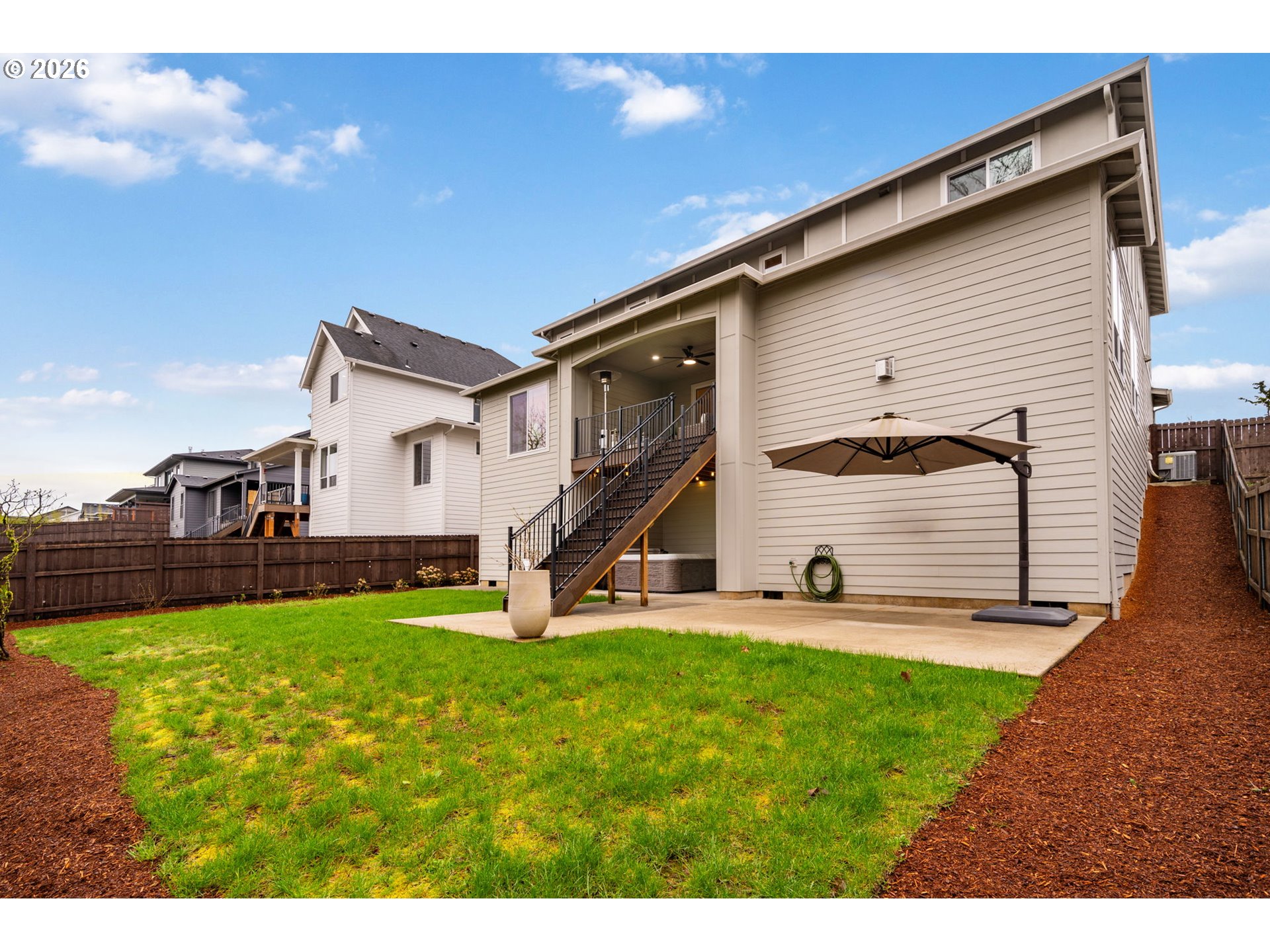 4024 South Winery Way Ridgefield, WA 98642 - Photo 41 of 48 a view of a house with a yard and sitting area