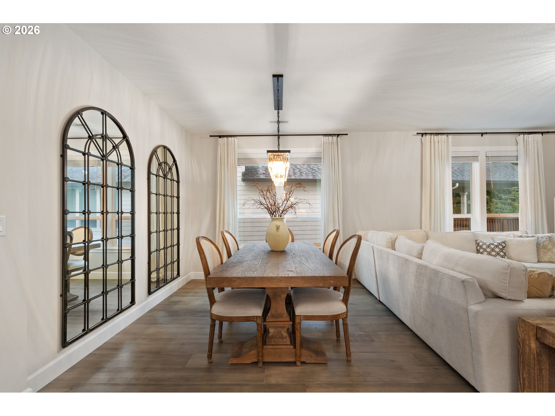 4024 South Winery Way Ridgefield, WA 98642 - Photo 6 of 48 a view of a dining room with furniture window and wooden floor