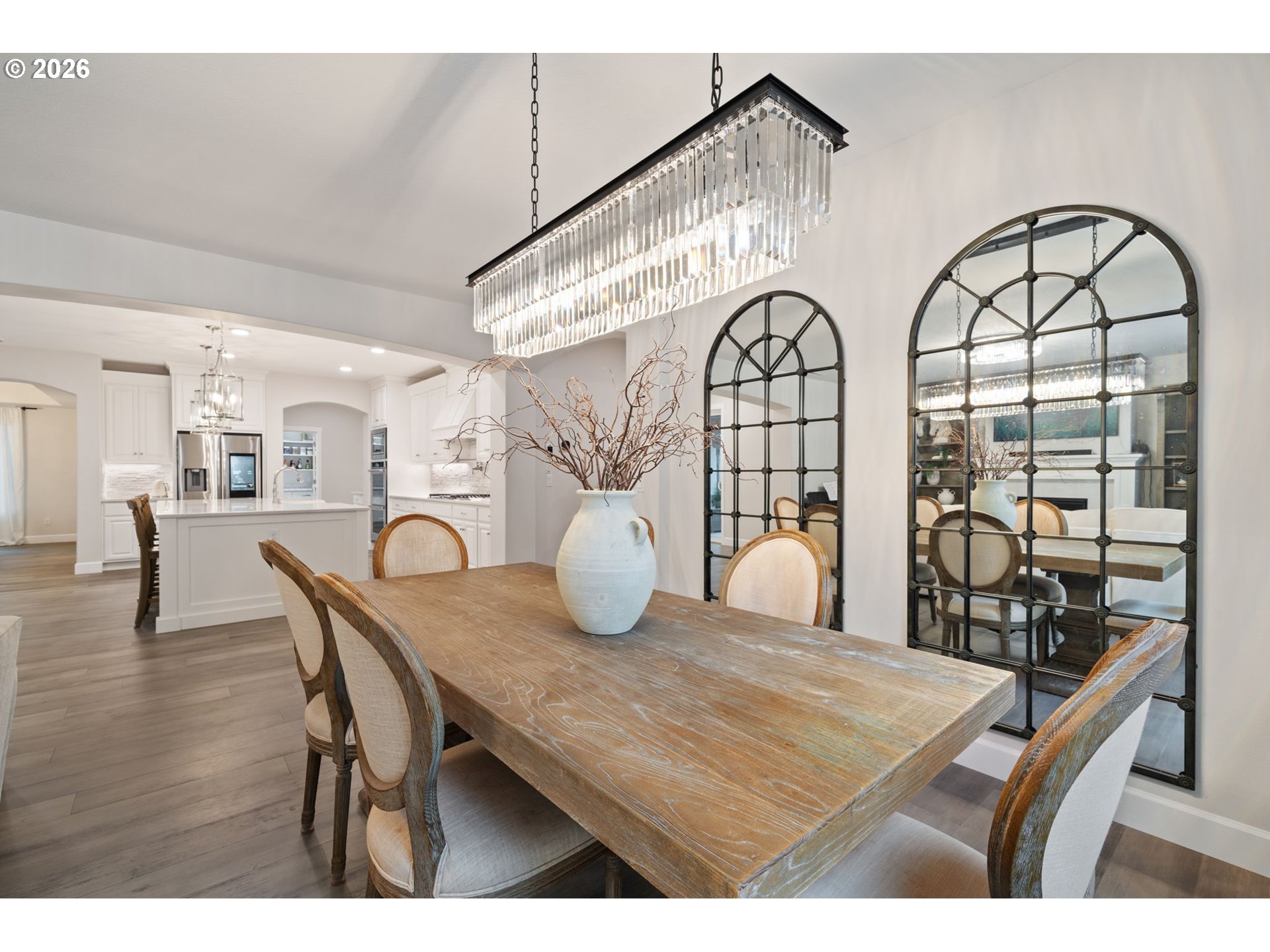 4024 South Winery Way Ridgefield, WA 98642 - Photo 8 of 48 a view of a dining room with furniture and wooden floor