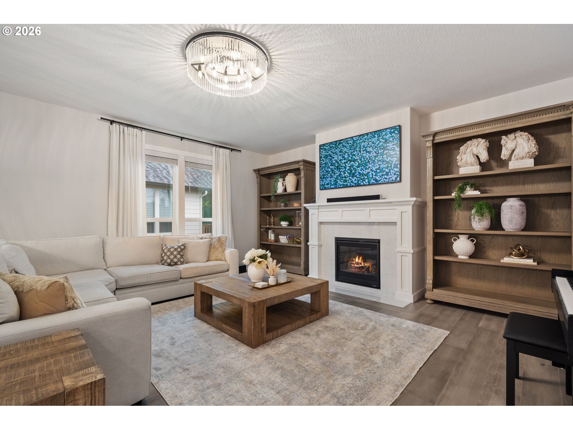 4024 South Winery Way Ridgefield, WA 98642 - Photo 10 of 48 a living room with furniture a fireplace and a window