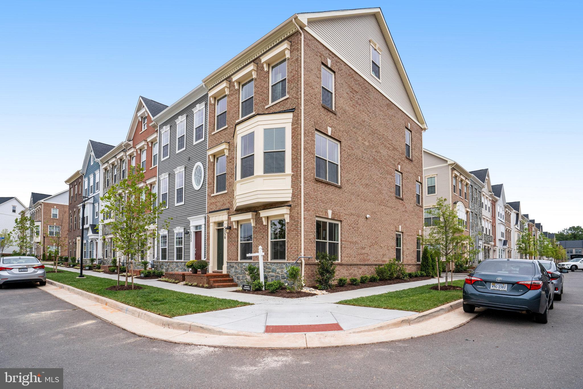 a view of multiple houses with a yard