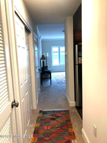 a view of a hallway view with living room