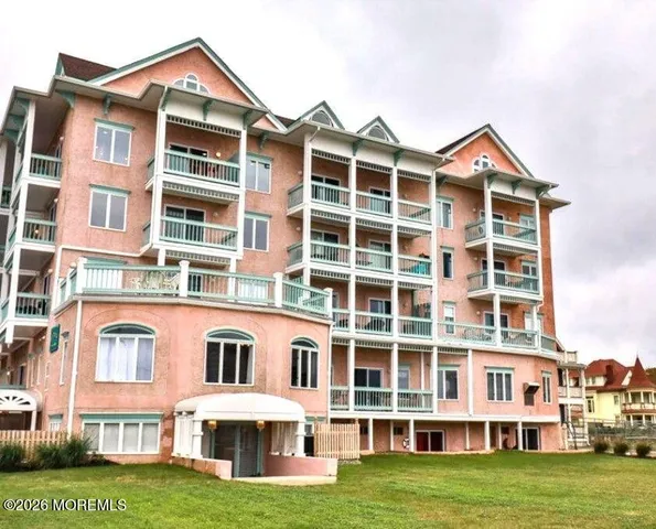 a front view of a building with a yard