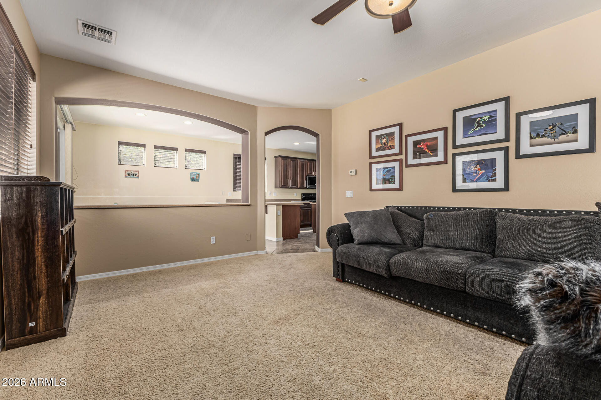 5513 West Rowel Road Phoenix, AZ 85083 - Photo 11 of 55 a living room with furniture and a flat screen tv