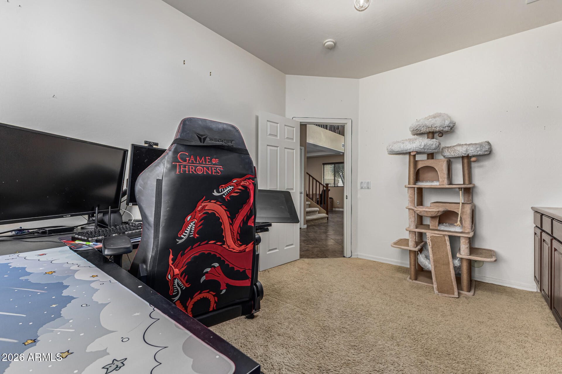 5513 West Rowel Road Phoenix, AZ 85083 - Photo 18 of 55 a bedroom with a bed and a flat screen tv