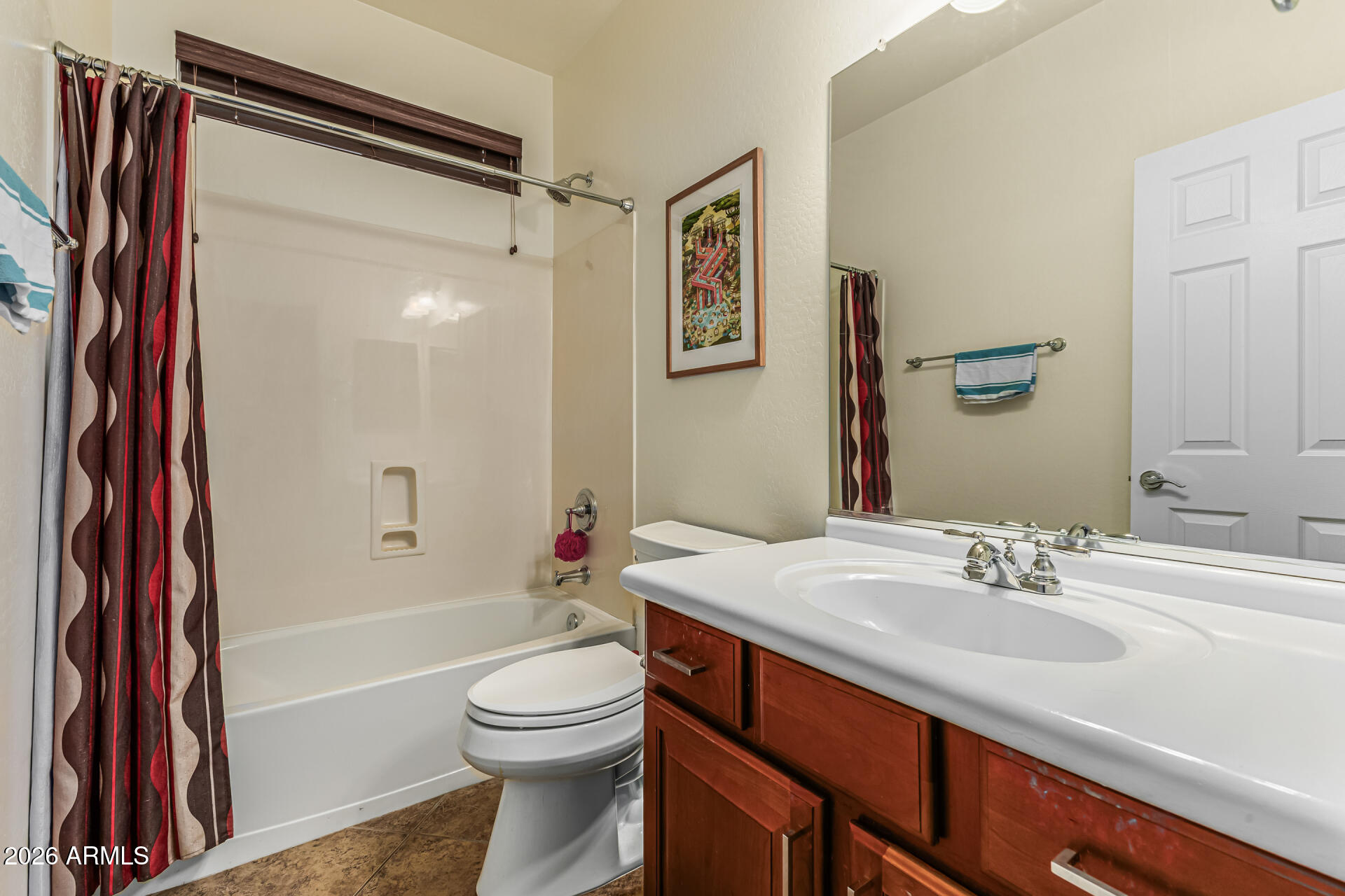5513 West Rowel Road Phoenix, AZ 85083 - Photo 19 of 55 a bathroom with a sink a toilet and shower