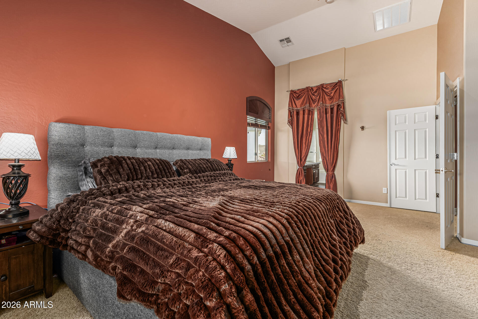 5513 West Rowel Road Phoenix, AZ 85083 - Photo 22 of 55 a bedroom with a bed and a mirror