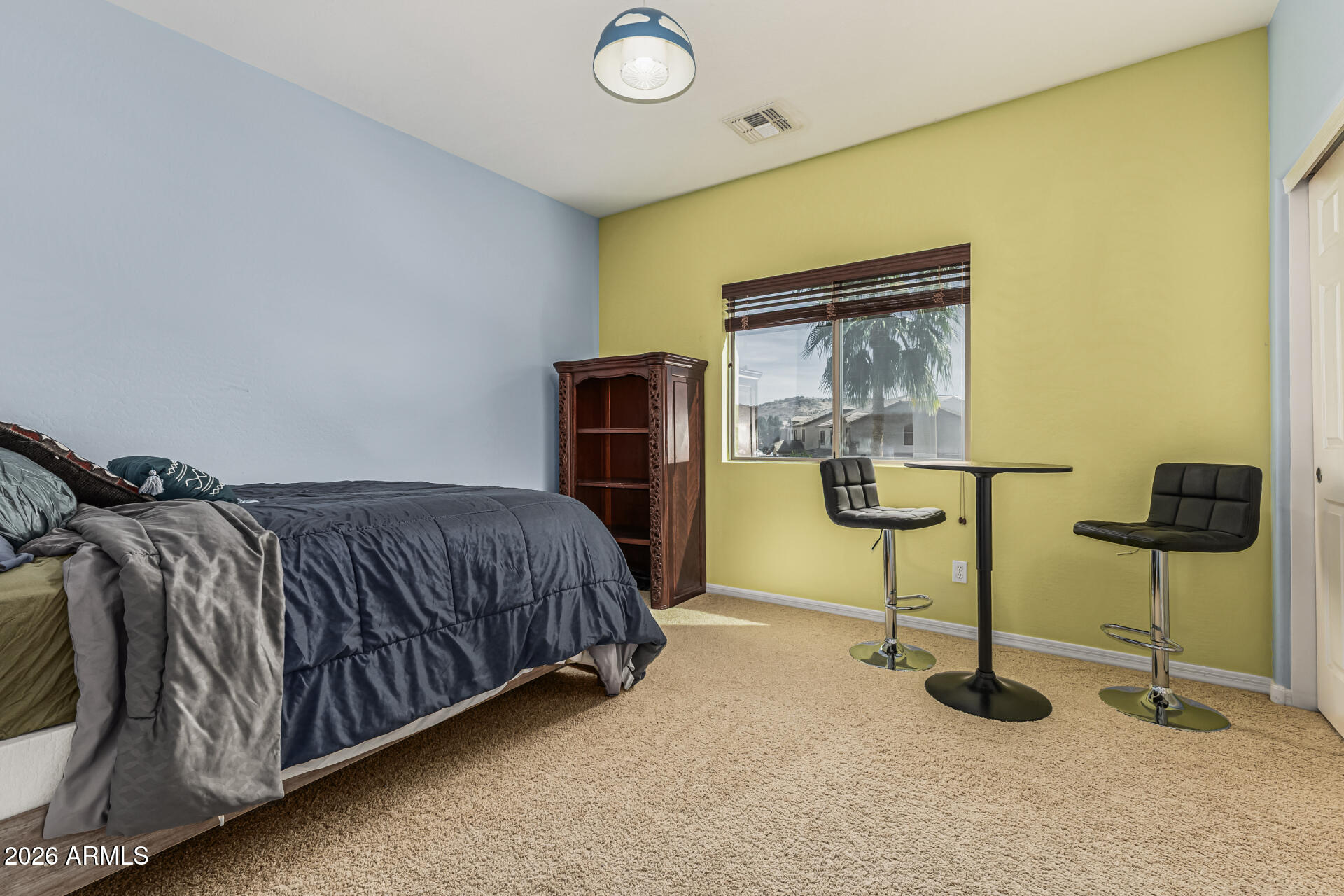 5513 West Rowel Road Phoenix, AZ 85083 - Photo 26 of 55 a bedroom with a bed and painting on the wall