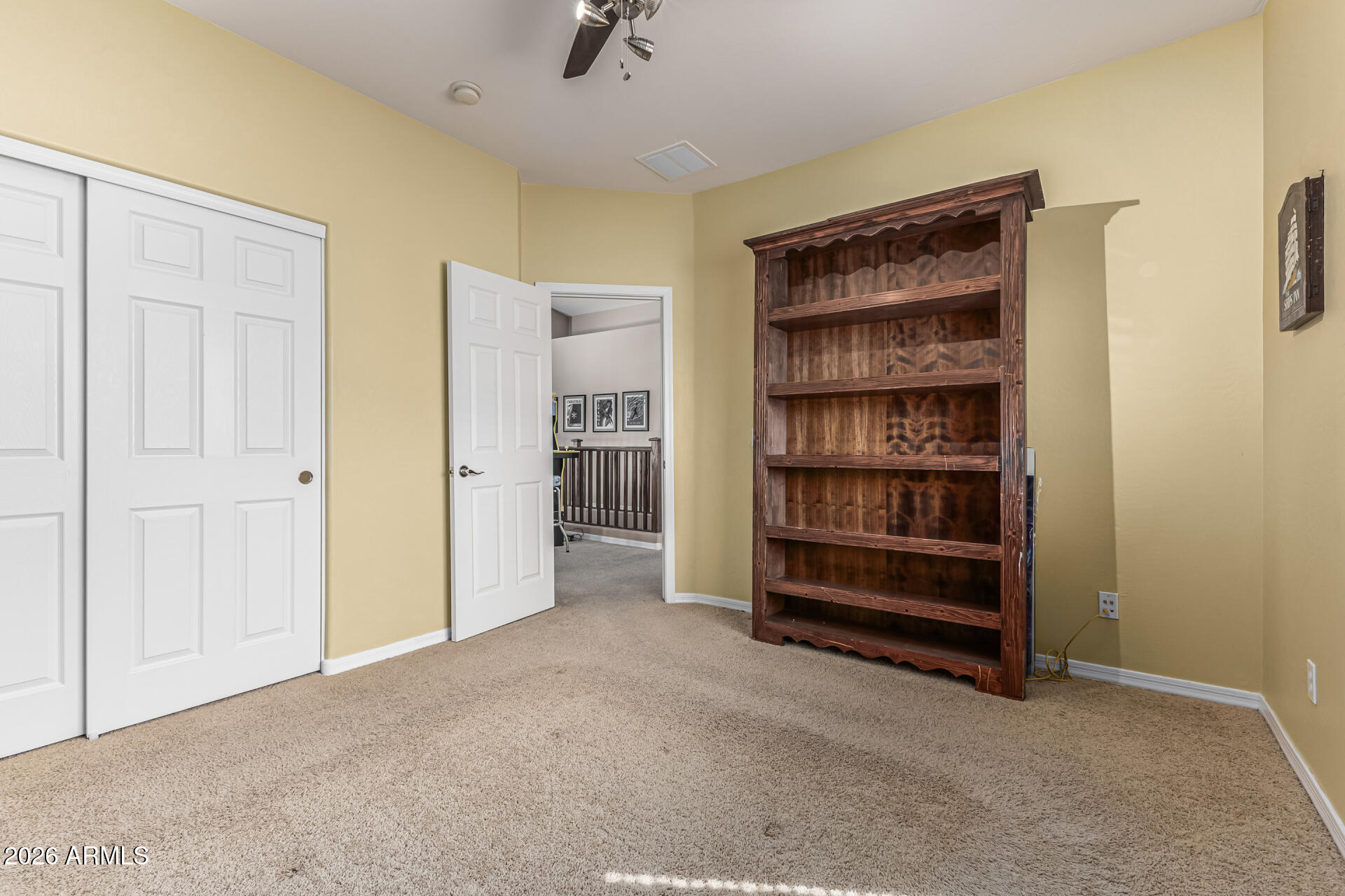 5513 West Rowel Road Phoenix, AZ 85083 - Photo 31 of 55 a view of room with cabinet and a bookshelf