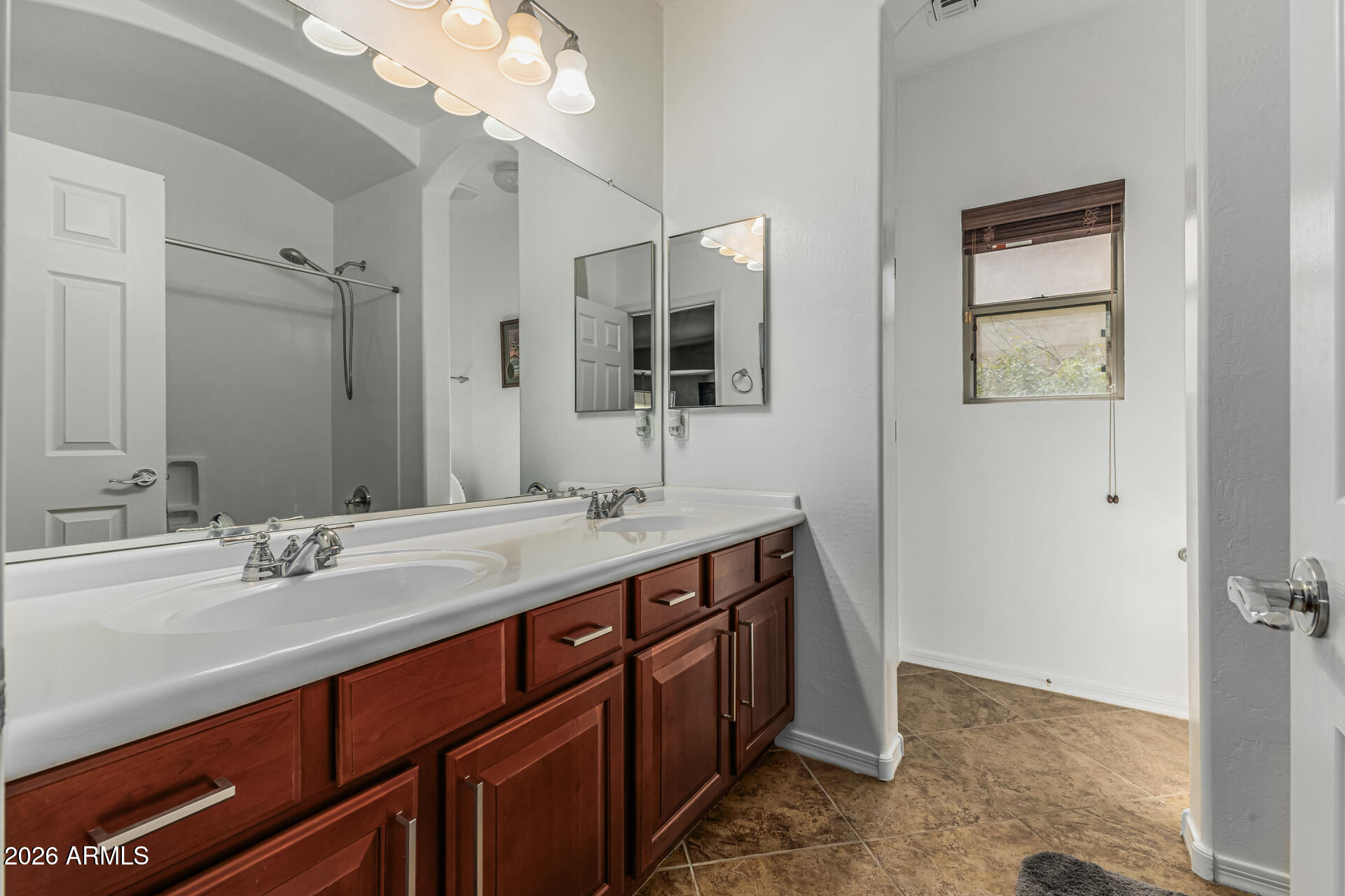 5513 West Rowel Road Phoenix, AZ 85083 - Photo 32 of 55 a bathroom with a double vanity sink and a mirror