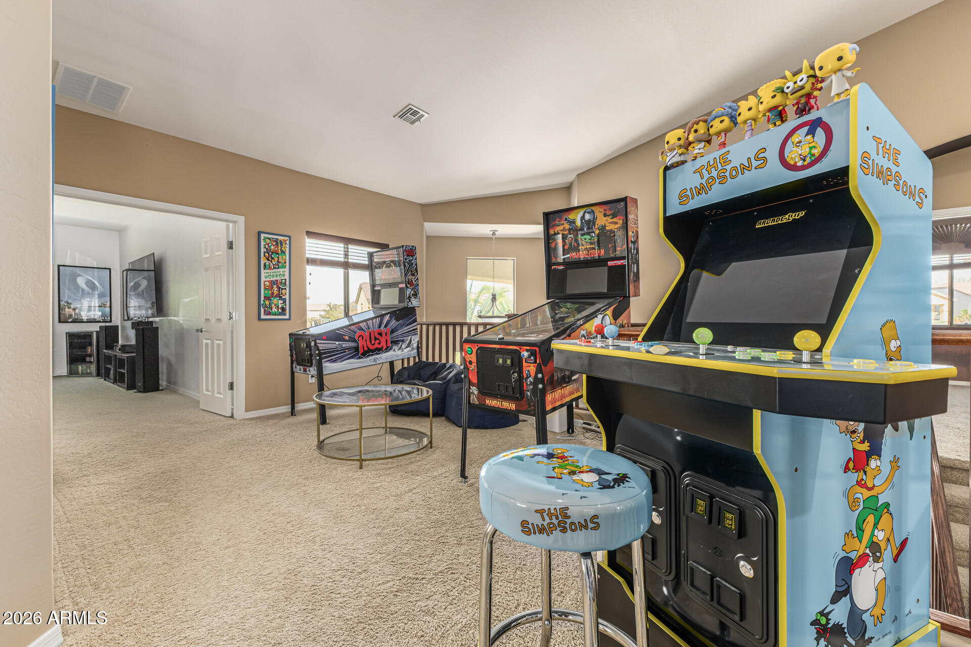 5513 West Rowel Road Phoenix, AZ 85083 - Photo 36 of 55 a living room with furniture and a flat screen tv