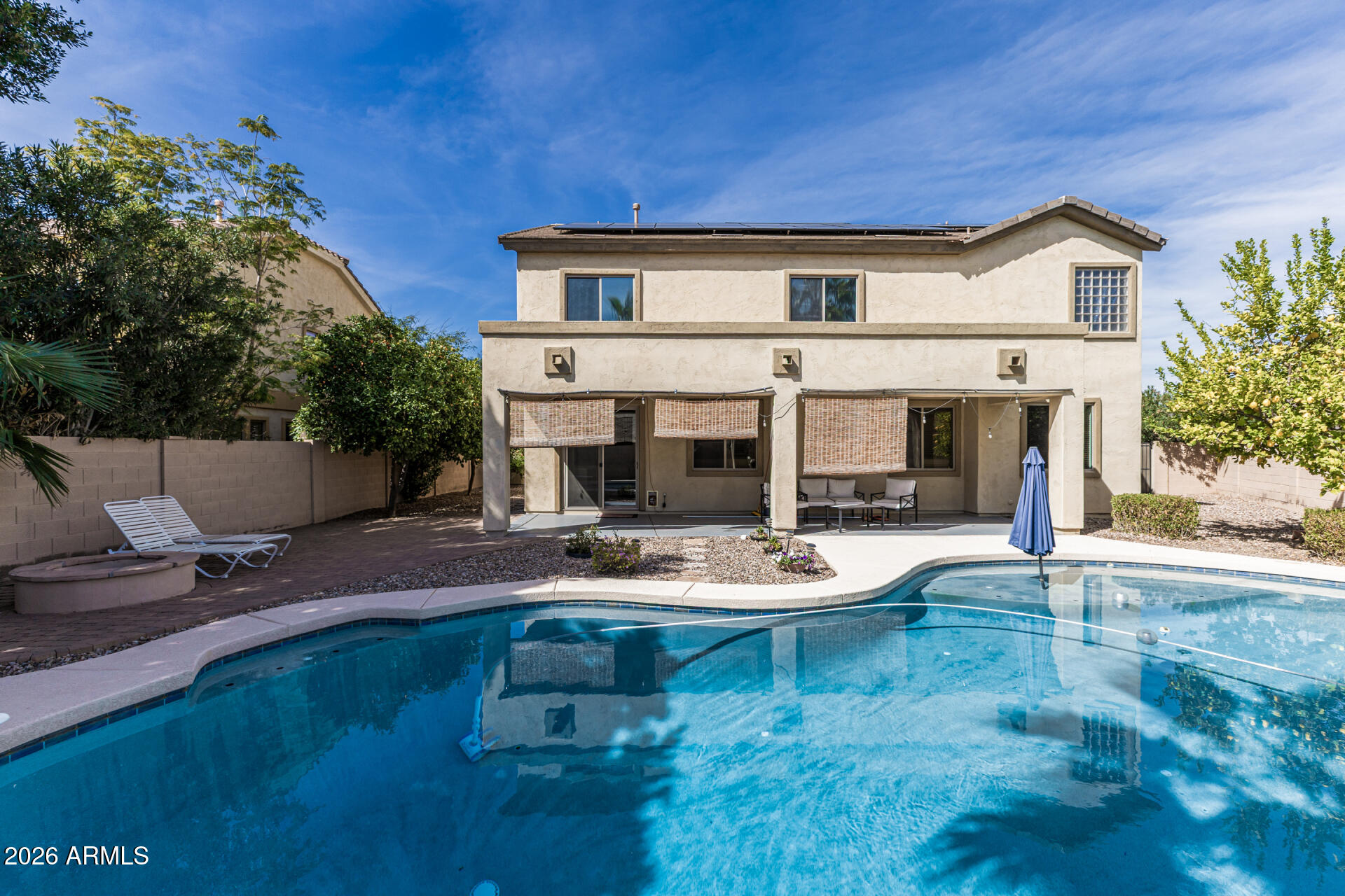 5513 West Rowel Road Phoenix, AZ 85083 - Photo 42 of 55 a view of a house with backyard porch and sitting area