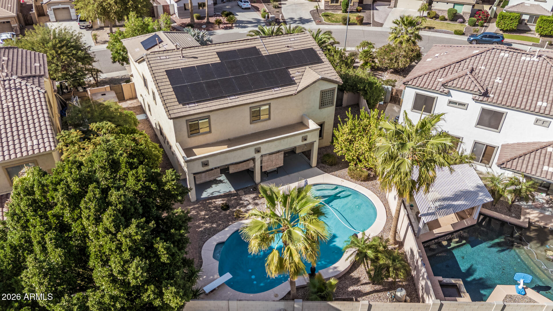 5513 West Rowel Road Phoenix, AZ 85083 - Photo 48 of 55 an aerial view of a house with a garden and trees