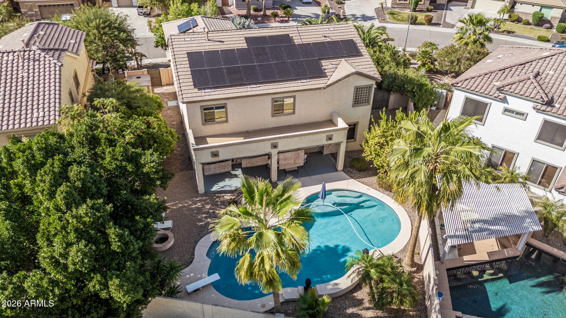 5513 West Rowel Road Phoenix, AZ 85083 - Photo 49 of 55 an aerial view of a residential apartment building with a yard and garden in the back