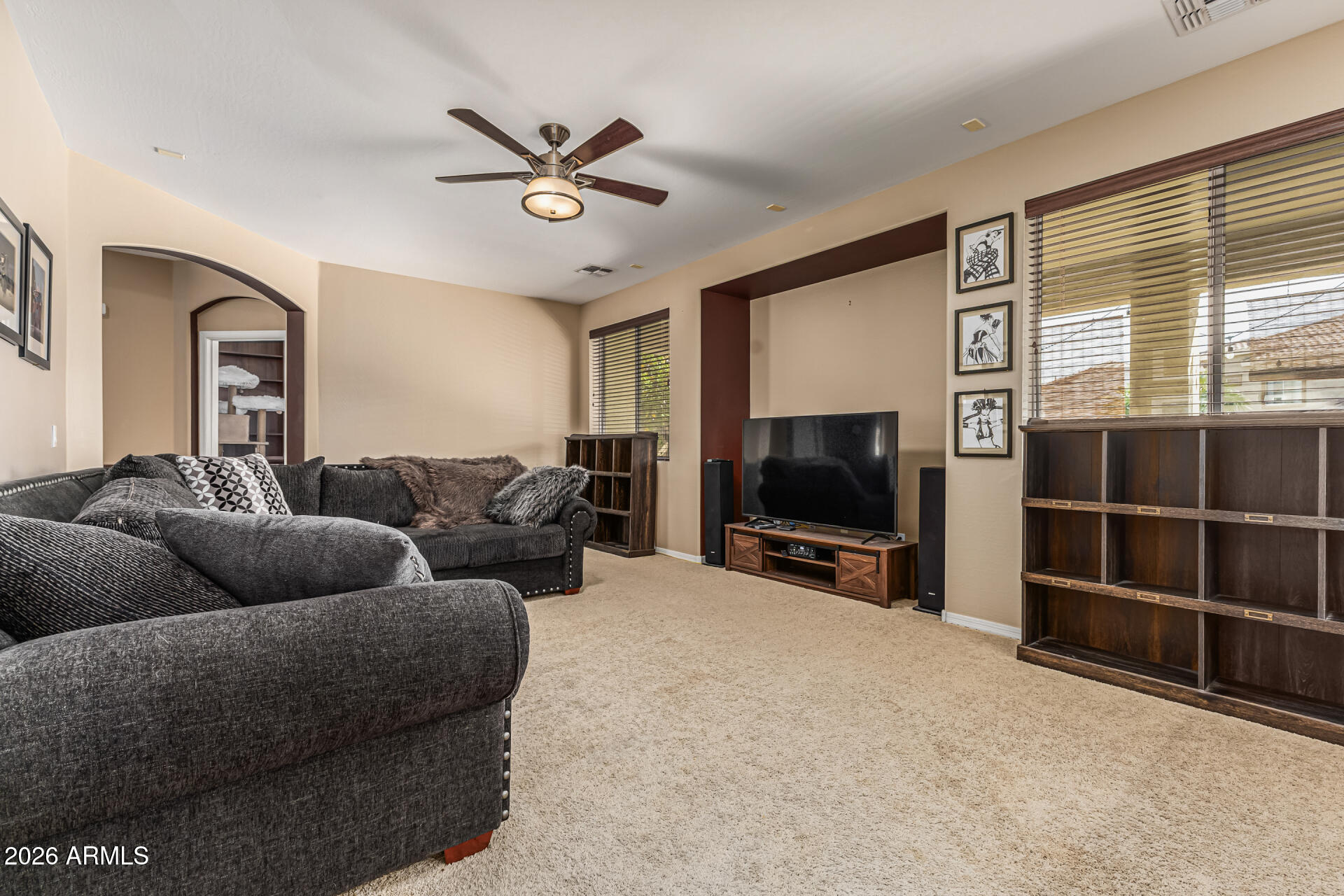 5513 West Rowel Road Phoenix, AZ 85083 - Photo 9 of 55 a living room with furniture and a flat screen tv