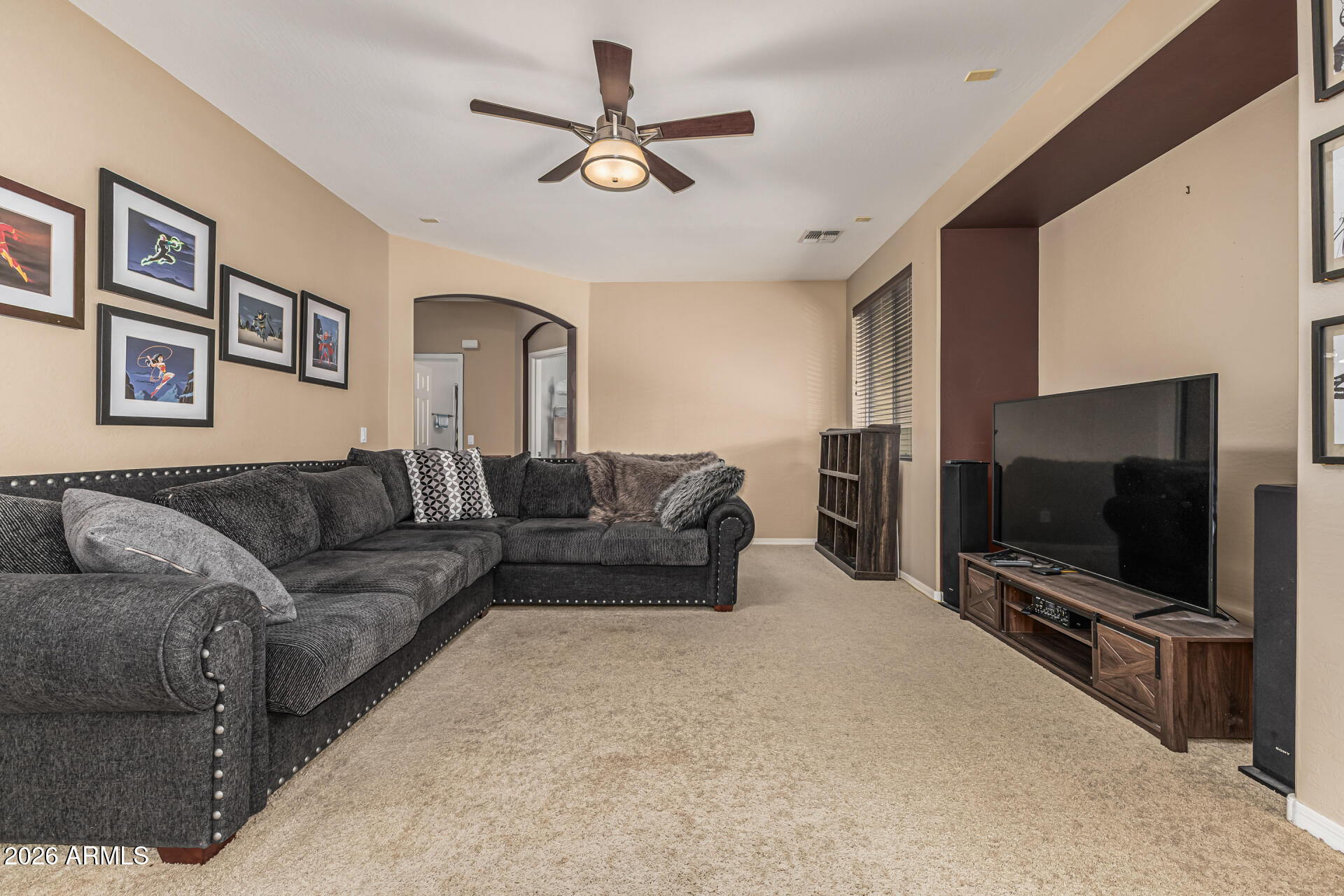 5513 West Rowel Road Phoenix, AZ 85083 - Photo 10 of 55 a living room with furniture and a flat screen tv