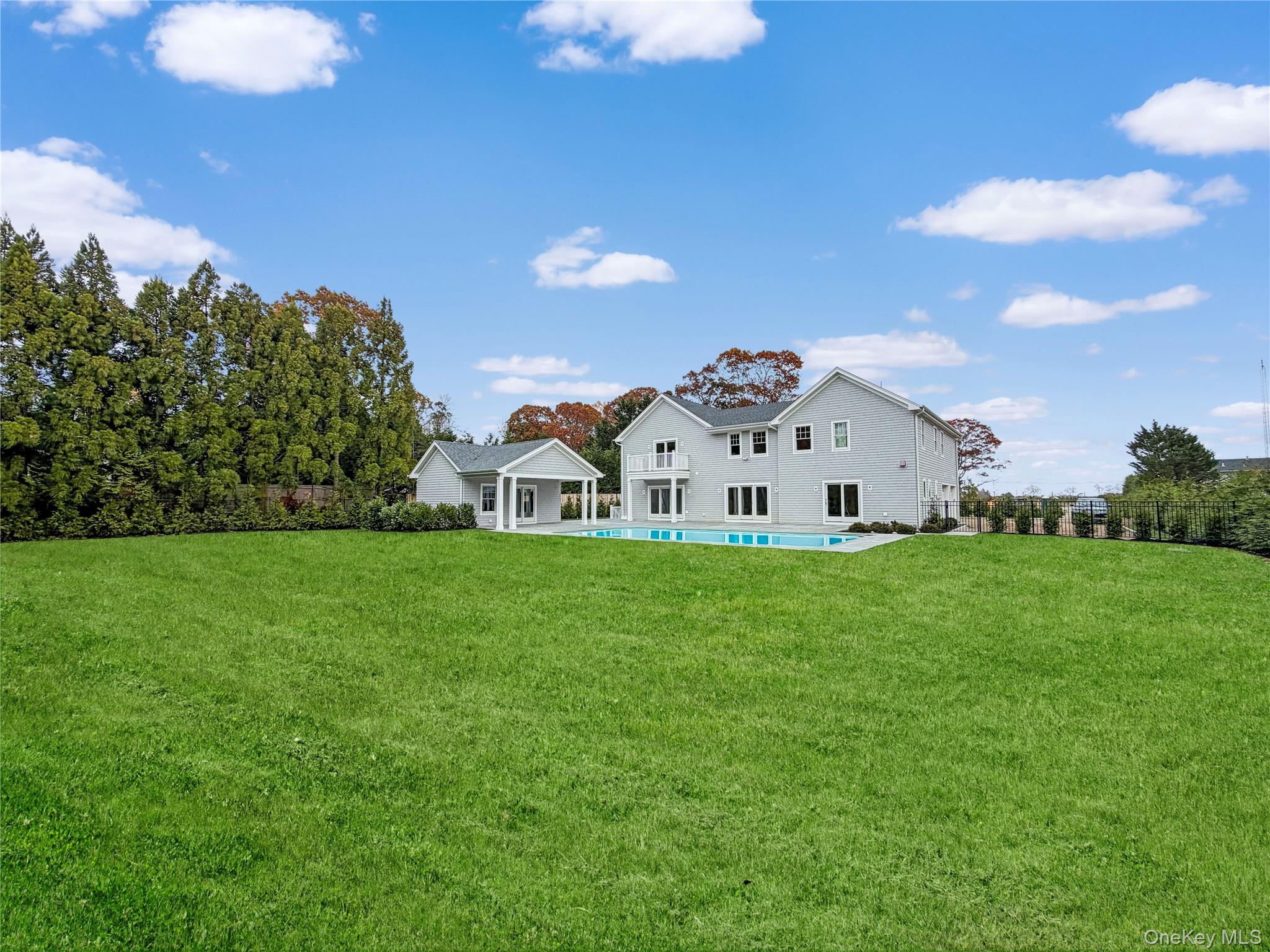 259 Majors Path Southampton, NY 11968 - Photo 3 of 4 a view of a white house with a yard