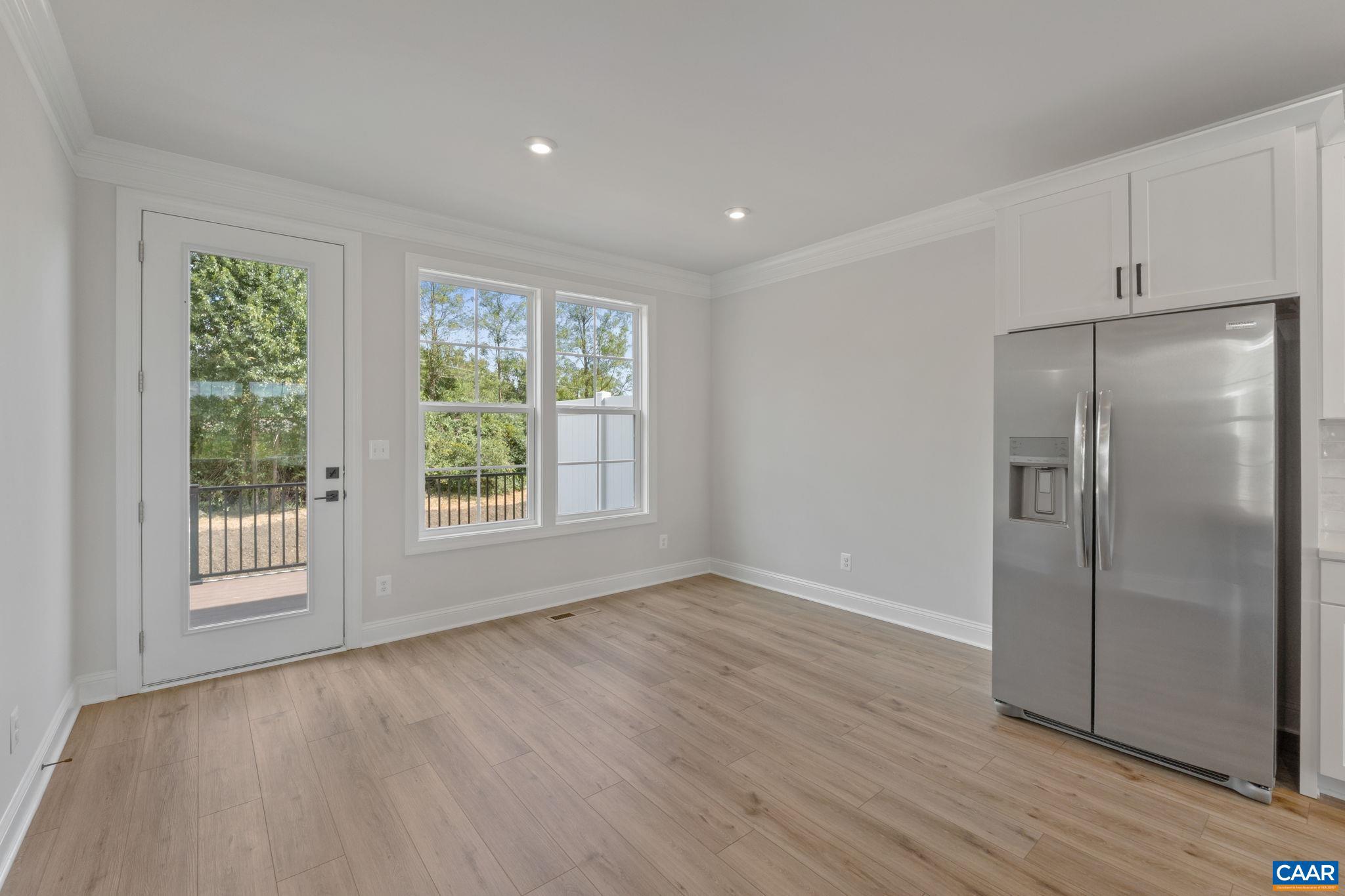 746 Park Ridge Drive Crozet, VA 22932 - Photo 19 of 46 a view of an empty room with wooden floor and a window