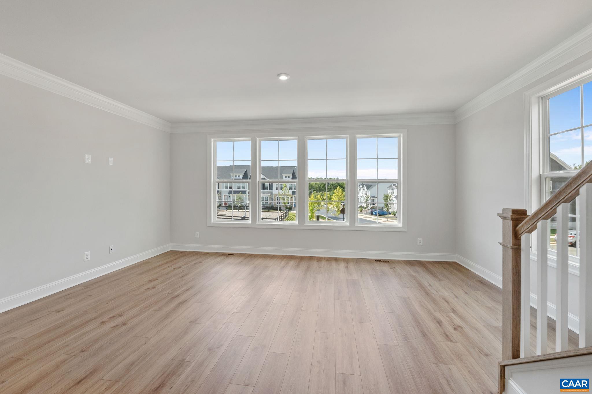 746 Park Ridge Drive Crozet, VA 22932 - Photo 26 of 46 an empty room with wooden floor and windows