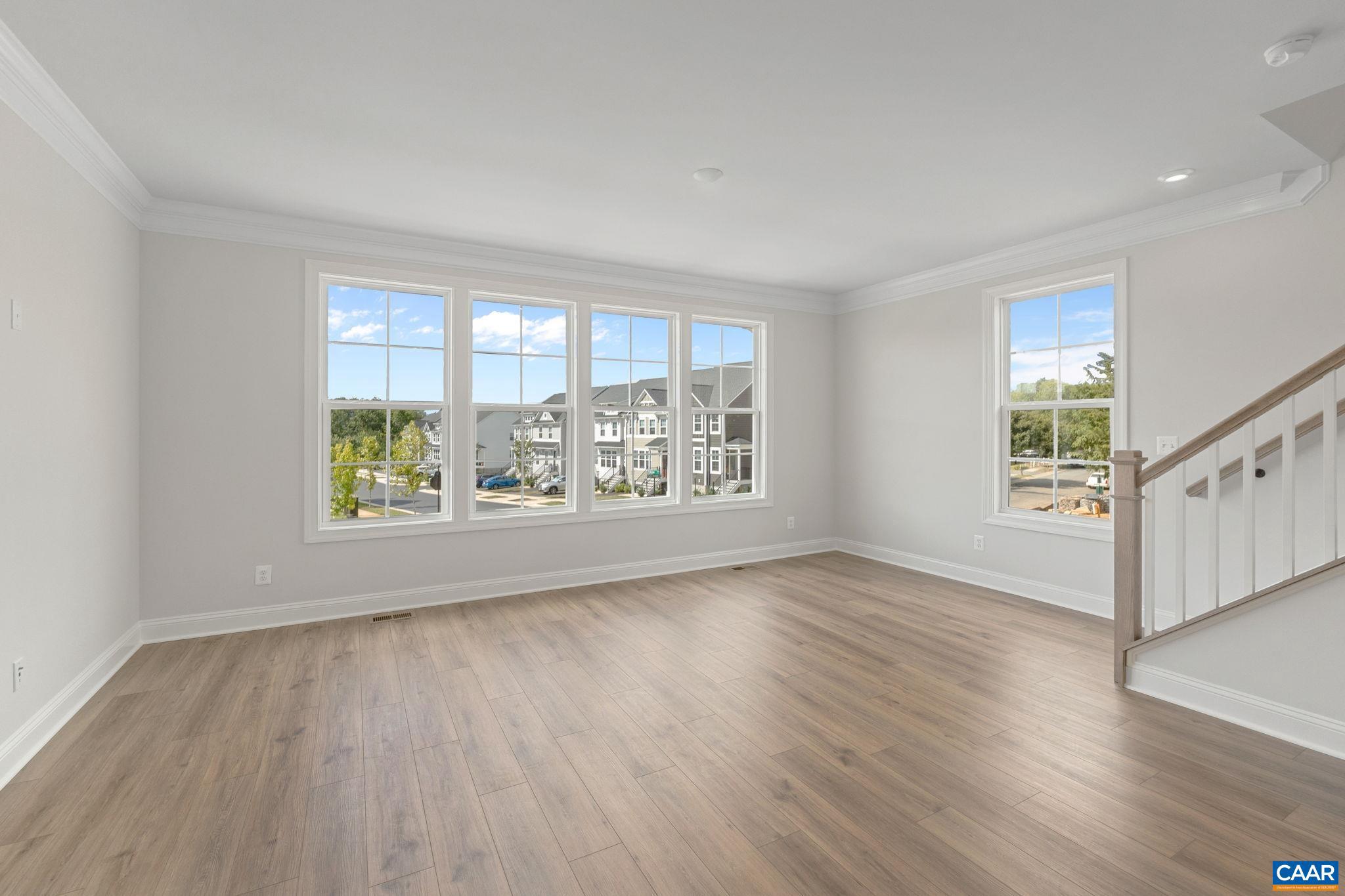 746 Park Ridge Drive Crozet, VA 22932 - Photo 27 of 46 an empty room with wooden floor and windows