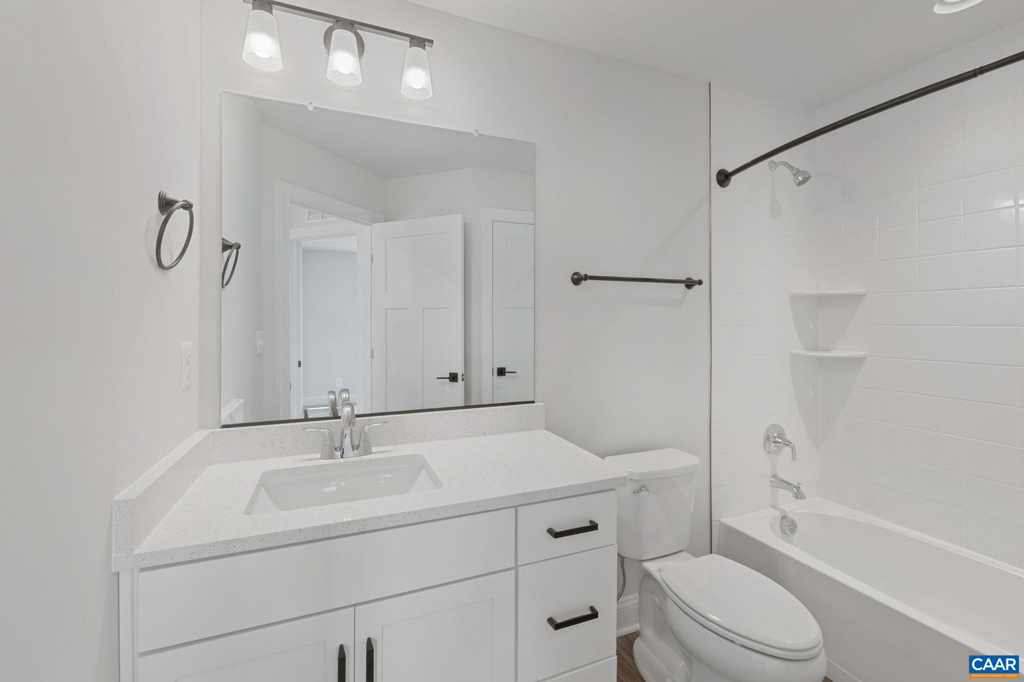 746 Park Ridge Drive Crozet, VA 22932 - Photo 37 of 46 a bathroom with a sink toilet vanity and shower