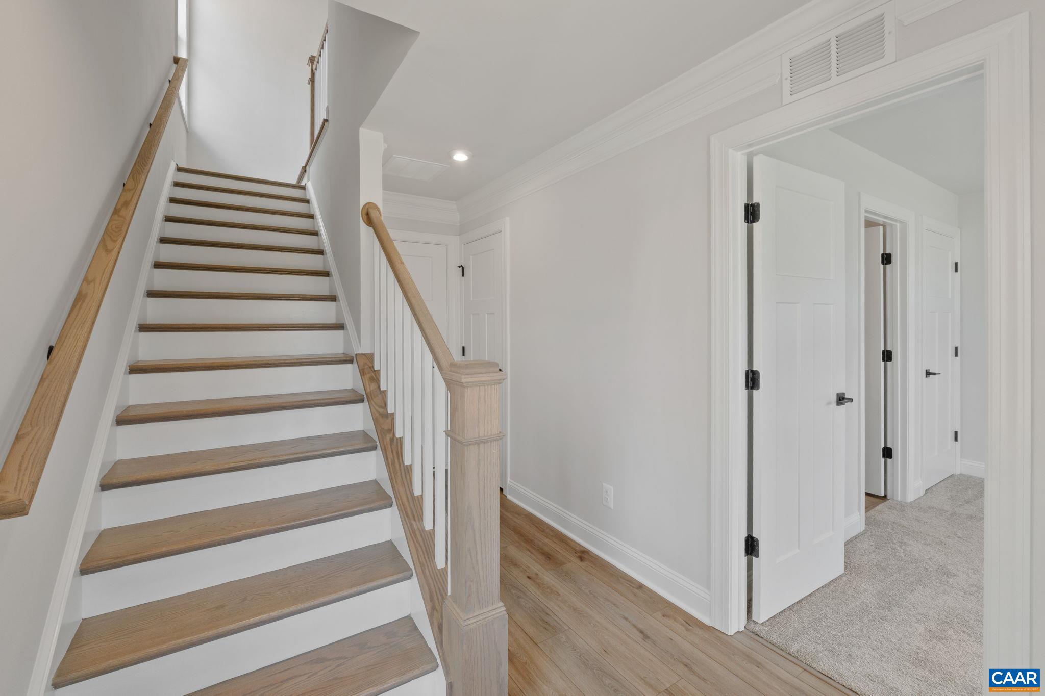 746 Park Ridge Drive Crozet, VA 22932 - Photo 7 of 46 a view of entryway with wooden floor and stairs