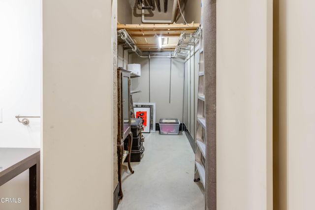 a view of a hallway with a flower pot