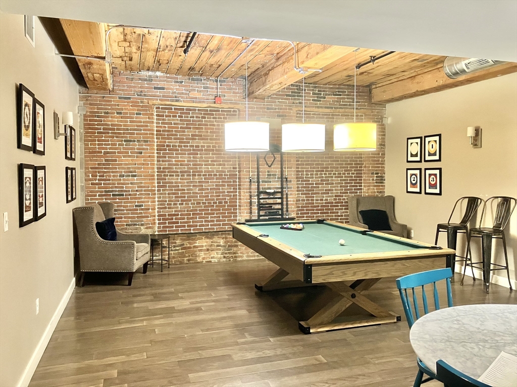 130 John Street, Unit G01 Lowell, MA 01852 - Photo 22 of 40 a room with pool table and windows