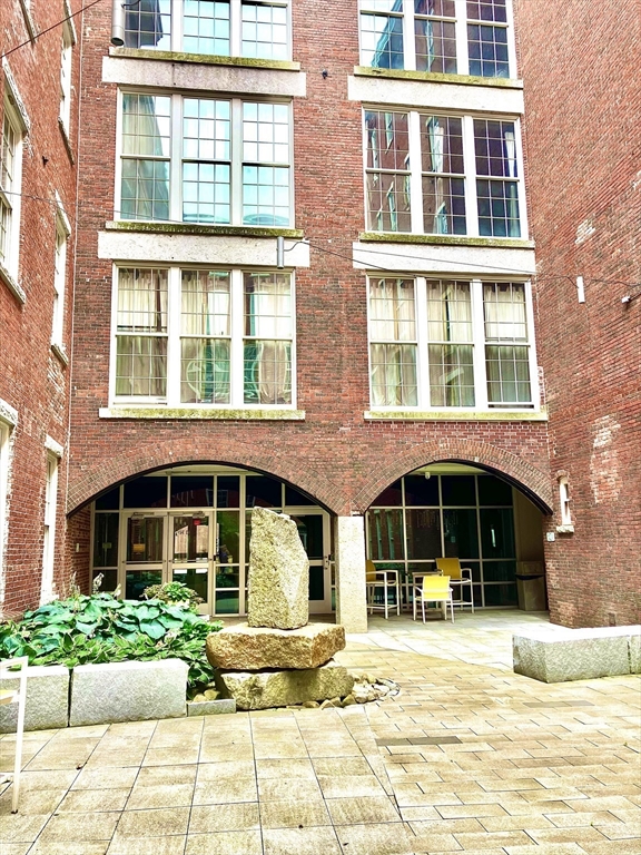 130 John Street, Unit G01 Lowell, MA 01852 - Photo 24 of 40 a front view of a building