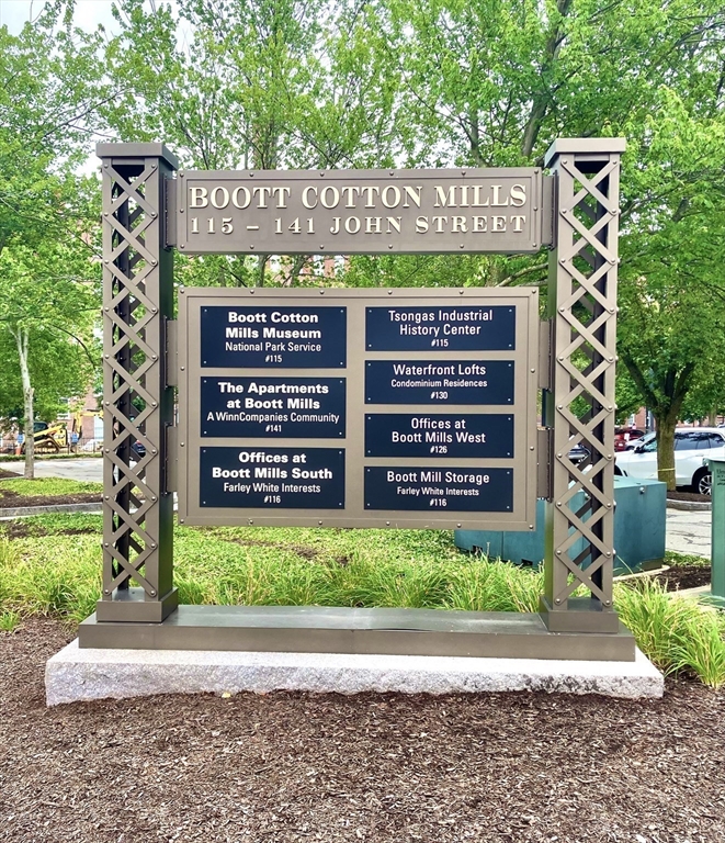 130 John Street, Unit G01 Lowell, MA 01852 - Photo 4 of 40 a sign on the side of a building