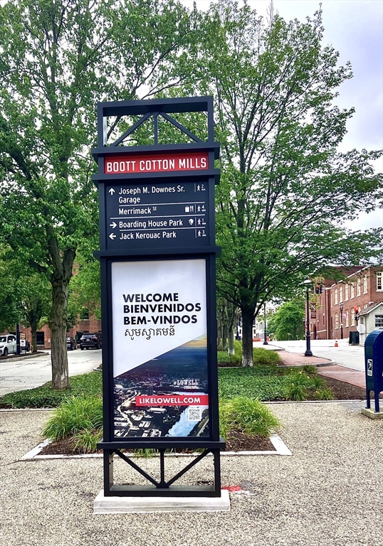 130 John Street, Unit G01 Lowell, MA 01852 - Photo 5 of 40 a sign on the side of the road