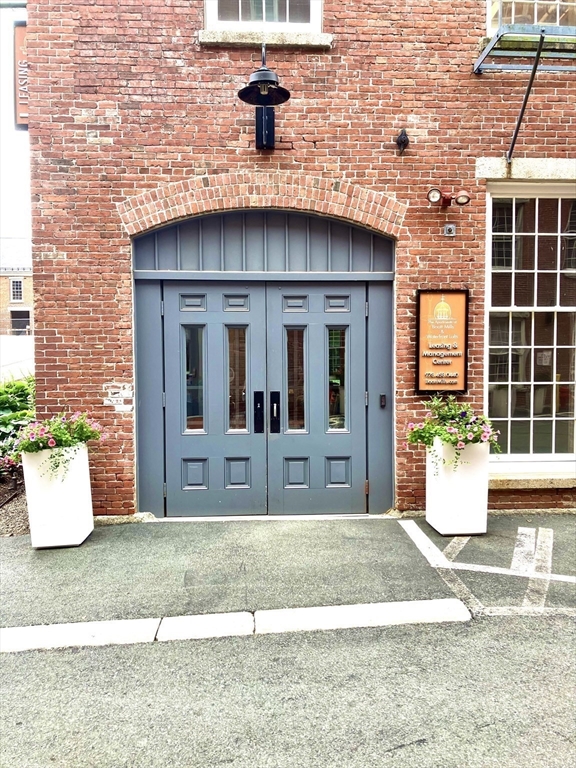 130 John Street, Unit G01 Lowell, MA 01852 - Photo 8 of 40 a view of house with outdoor space
