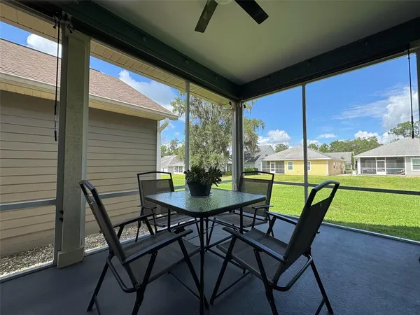 a view of an outdoor space with furniture and garden