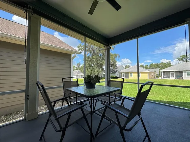 a view of an outdoor space with furniture and garden