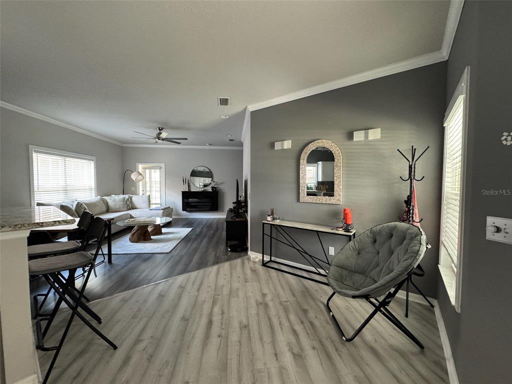 1376 Northwest 120th Way Gainesville, FL 32606 - Photo 3 of 21 a living room with furniture and wooden floor