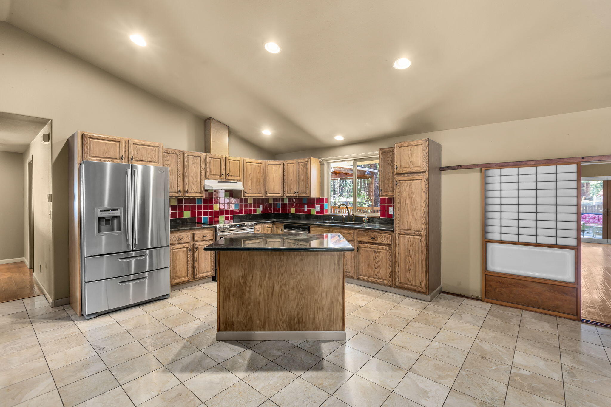 59842 Navajo Road Bend, OR 97702 - Photo 6 of 52 a kitchen with refrigerator and cabinets
