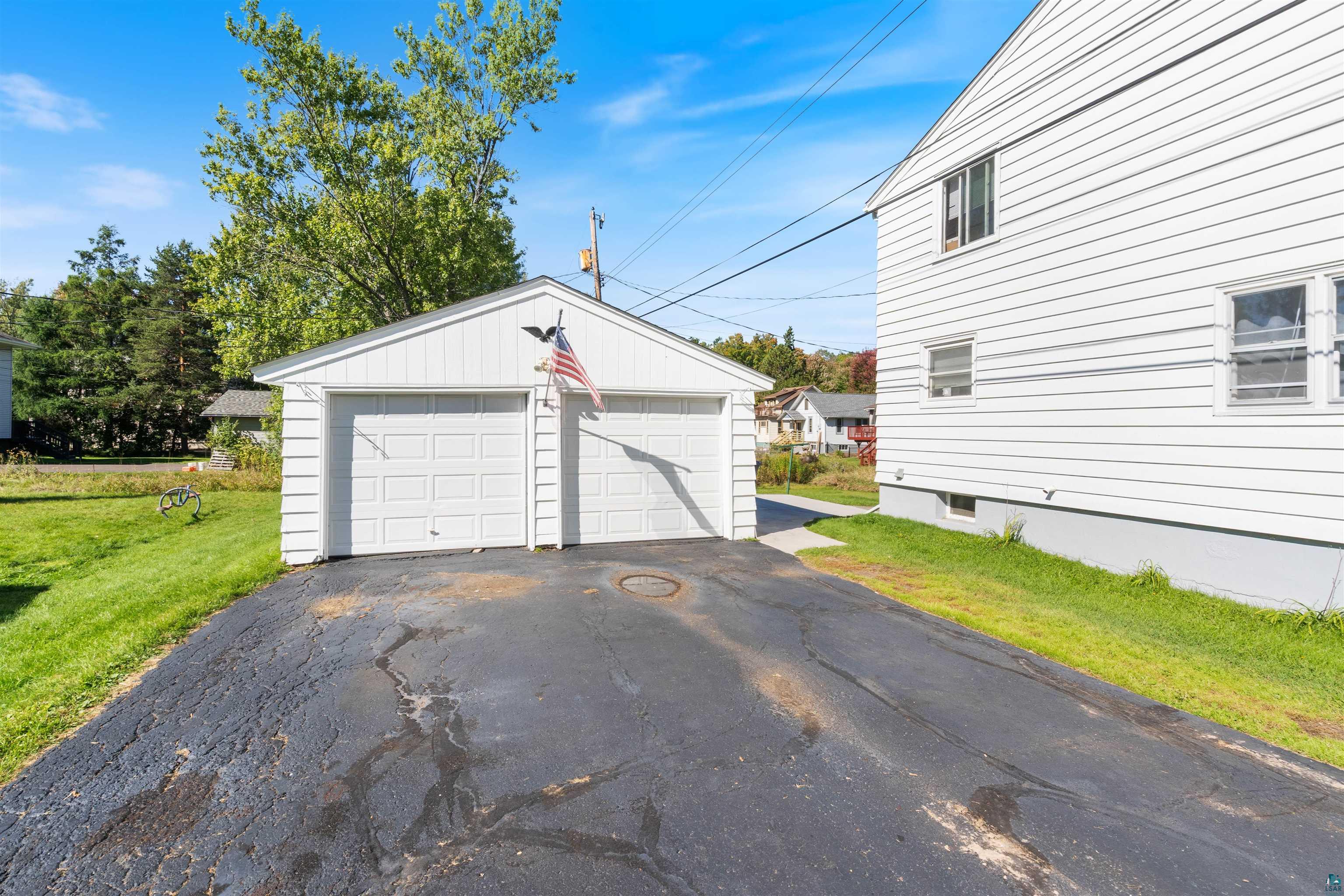 3715 Rendle Avenue Duluth, MN 55803 - Photo 6 of 20 Detached two-car garage with white paneled garage doors
