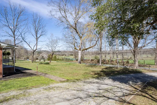 a view of lake with a yard