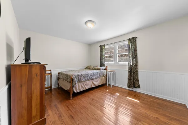 a bed room with a bed and a window