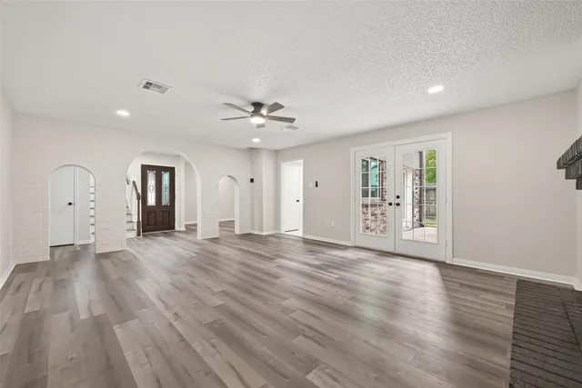 a kitchen with stainless steel appliances granite countertop a sink and a stove